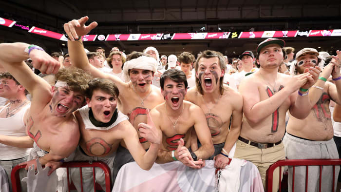 Arkansas fans lose their minds at a white-out game upset of No. 1 Auburn at Bud Walton Arena.